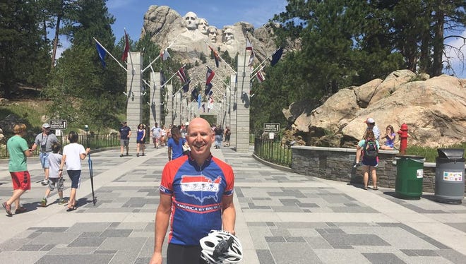 Former Gov. Jack Markell's bike trip across the country stopped at Mount Rushmore.