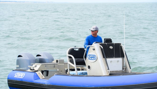 OCEARCH founder Chris Fischer is aboard the SAFE boat on his way to assist the Contender with one of the two sand  tiger sharks that were caught off of the Delaware Seashore near the Indian River Bridge on Tuesday, July 11, 2017.