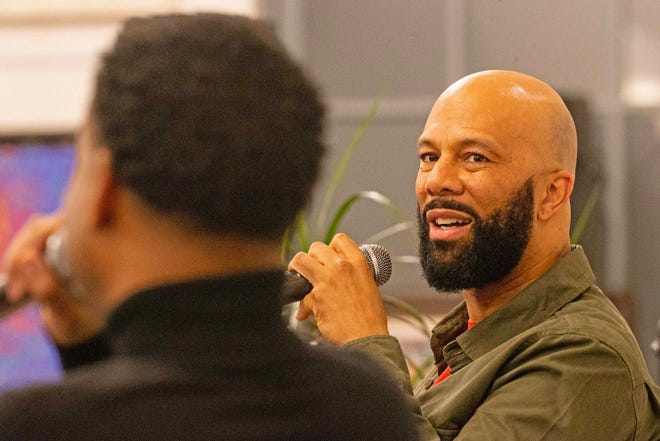 Common, rapper, actor, writer and activist, fields questions from moderator Forrest Foster, Assistant Dean of Libraries and Associate Professor at North Carolina's A&T, during a book talk and signing event for And Then We Rise: A Guide to Loving and Taking Care of Self at the Wilmington Public Library on Friday, Jan 26, 2024. A capacity crowd of approximately 350 people attended.