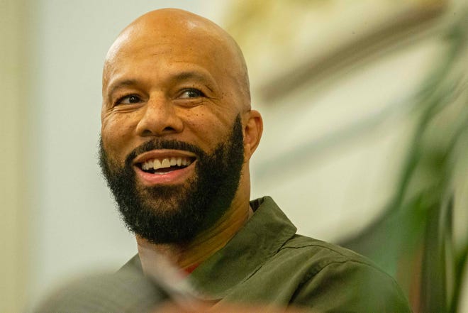 Common, rapper, actor, writer and activist, smiles as he fields questions during a book talk and signing event for his book And Then We Rise: A Guide to Loving and Taking Care of Self at the Wilmington Public Library on Friday, Jan 26, 2024. A capacity crowd of approximately 350 people attended.